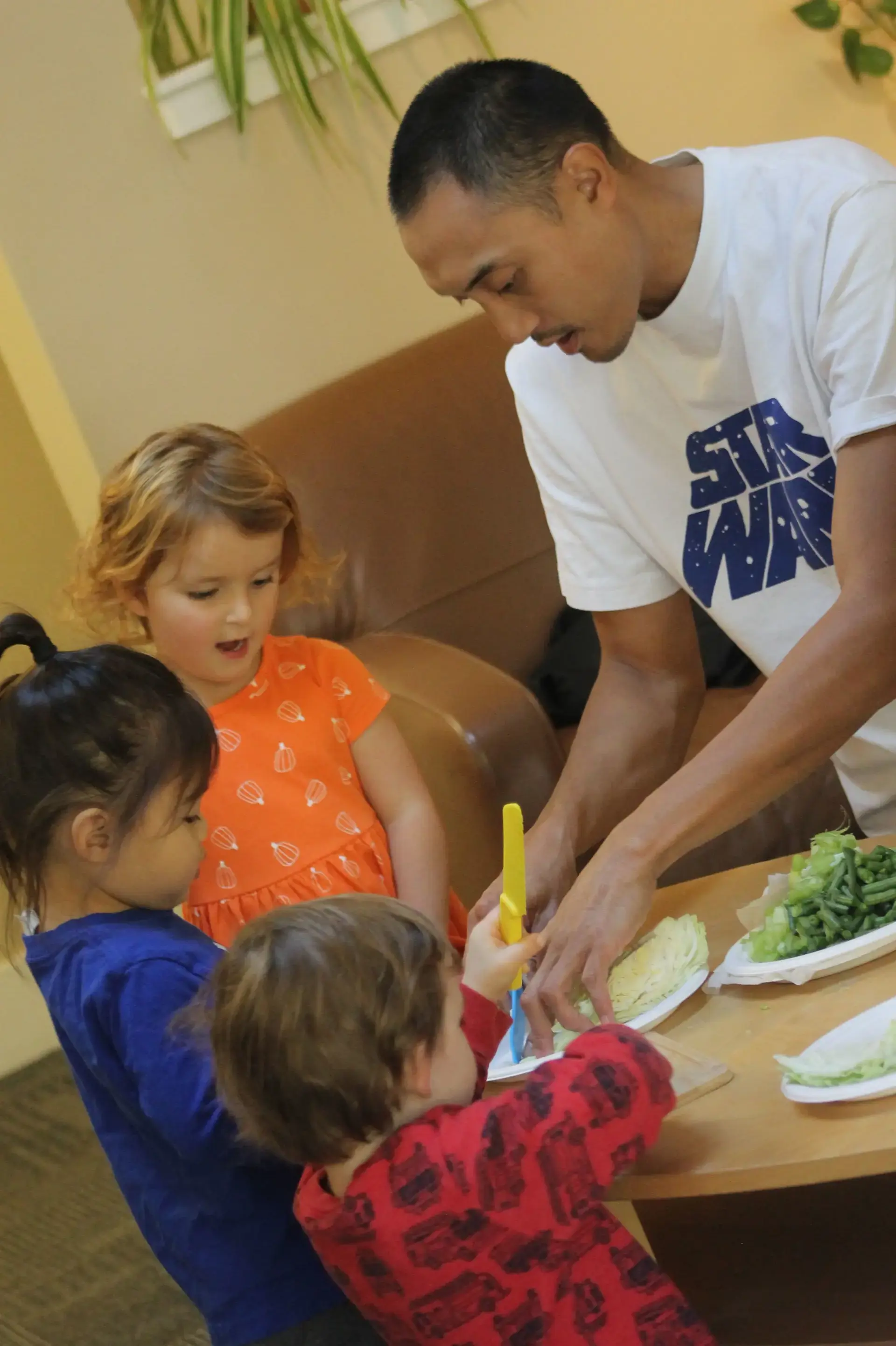 Parents assisting students during cooking class