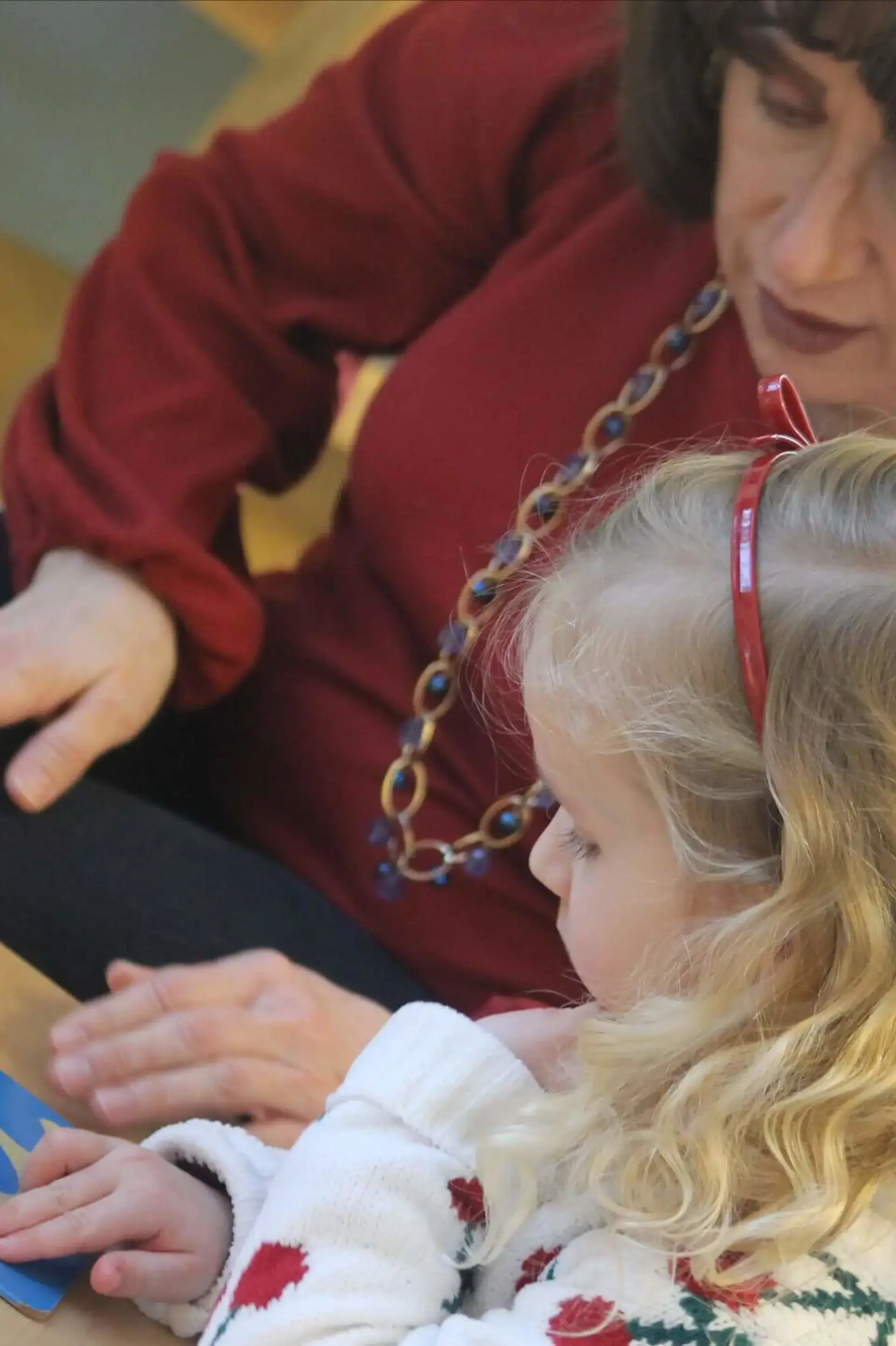 Student and teacher reading together