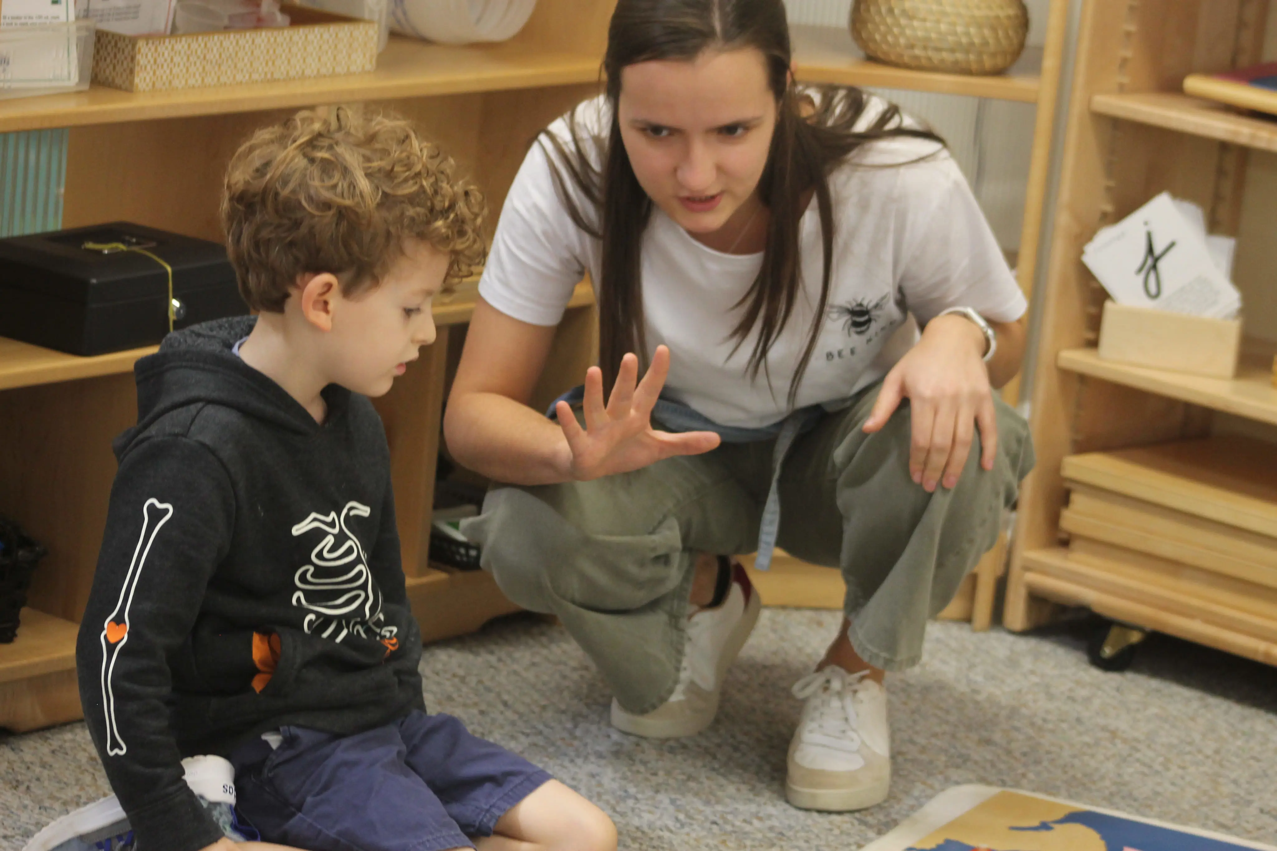 Teacher guiding student